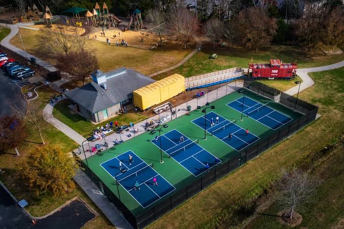 Pickleball courts, playground, and caboose behind Collegedale City Hall, TN