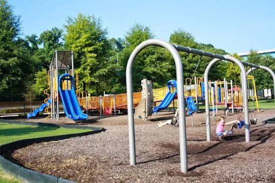 Riverfront Playground slides and swings