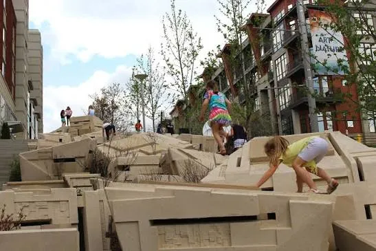 Children climbing The Scramble public art installation