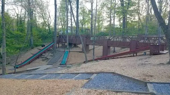 Wooden play structure and slides at The Pumpkin Patch Playground